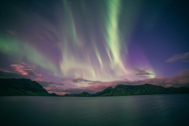 the northern lights with green and purple streaks