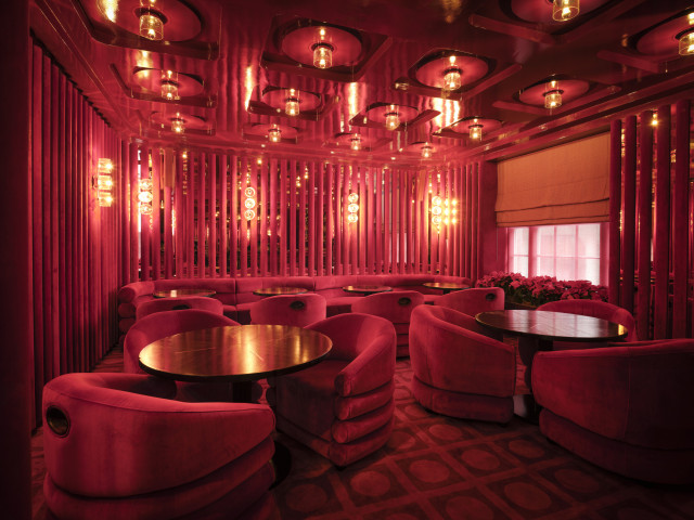 bar area inside langan's upstairs with red lighting 