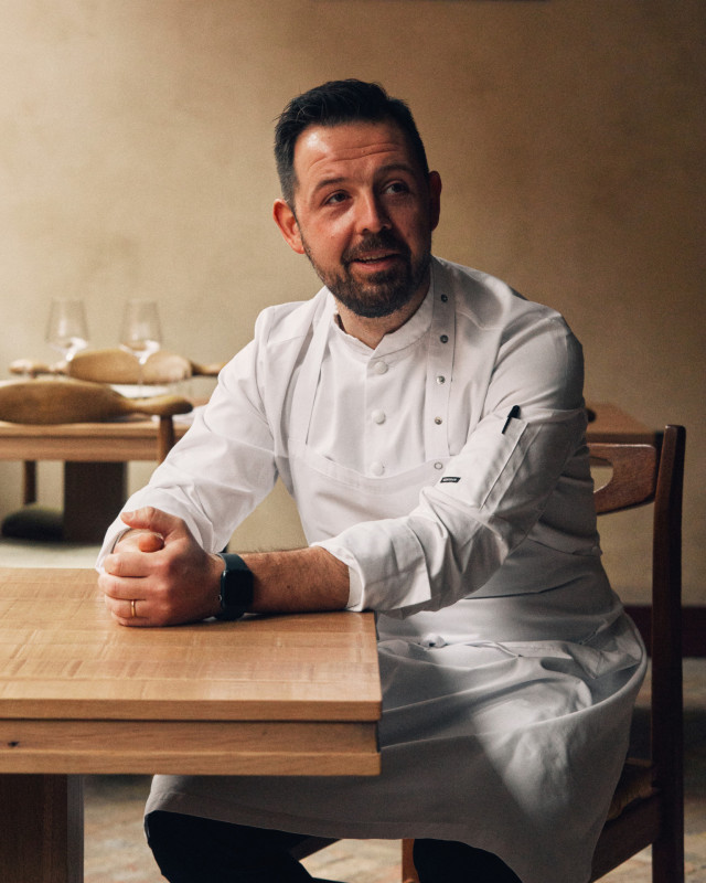 chef sat at restaurant table 