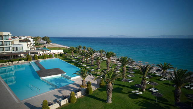 view of ixian all grand hotel with sea in the distance