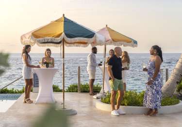 Group of people enjoying cocktails in bermuda.