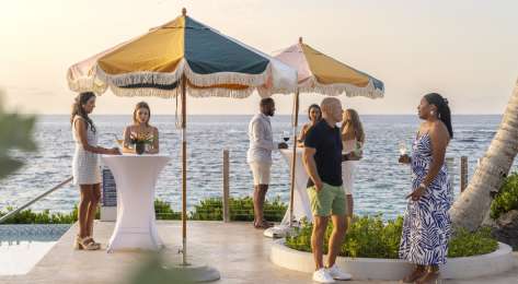 Group of people enjoying cocktails in bermuda.