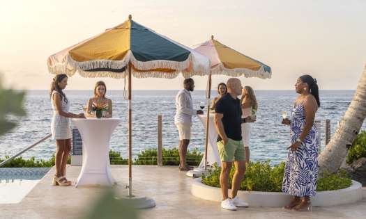 Group of people enjoying cocktails in bermuda.
