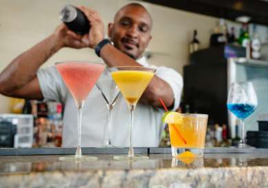 Bartender making cocktails in bermuda .