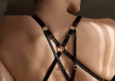 Model wearing black bordelle bra .