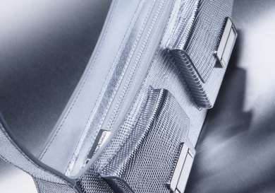 Silver handbag with two pockets on the front.