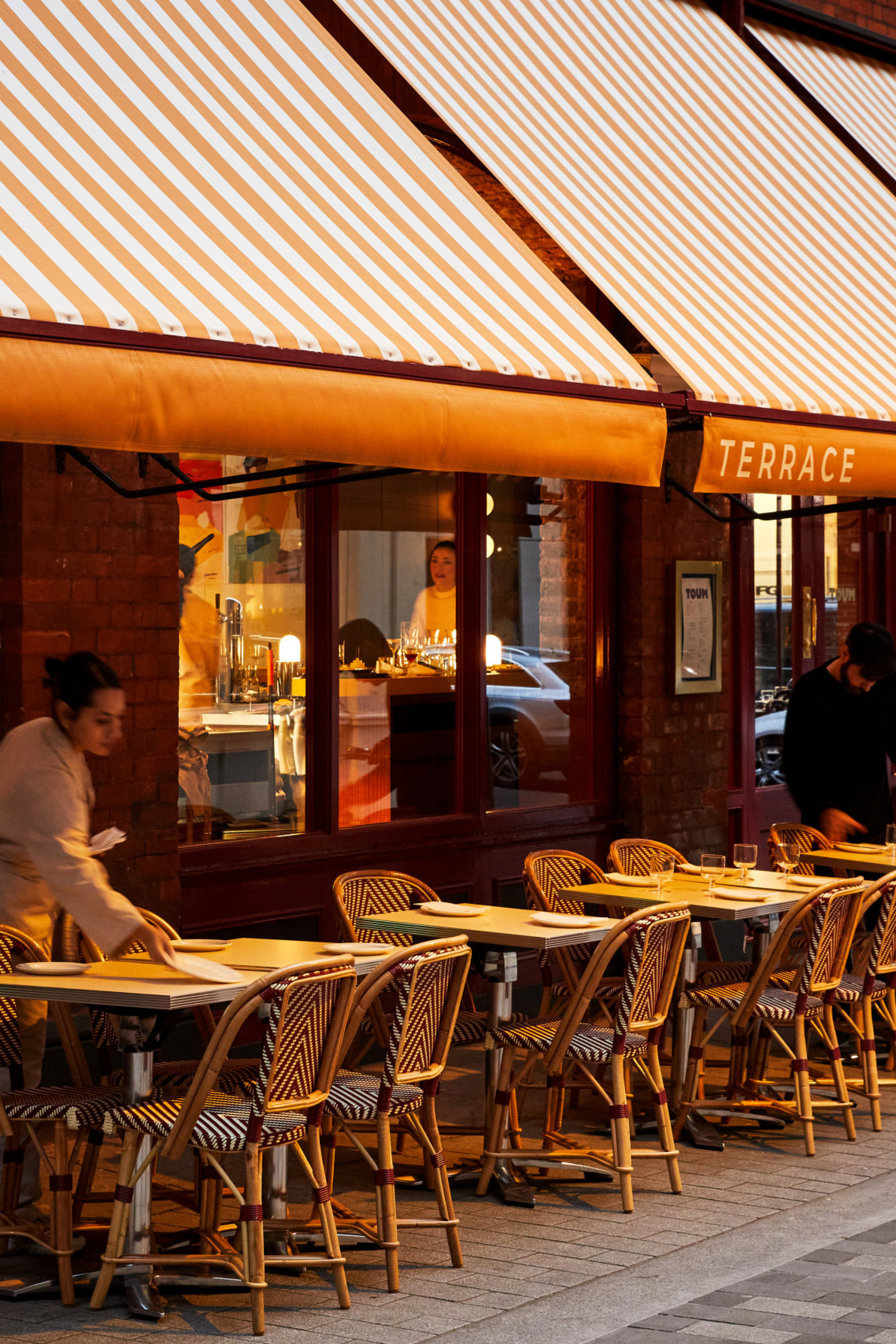 photo of toum restaurant with striped awning 