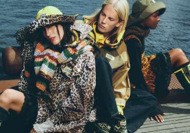 Ganni x hunter collaboration with ponchos and rain hats .