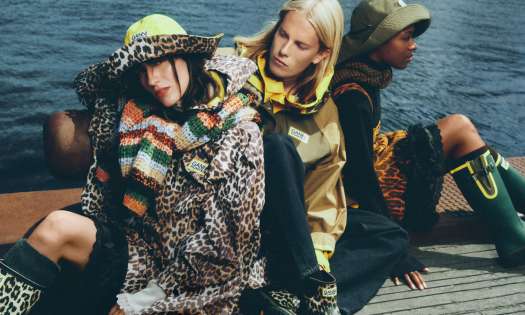 Ganni x hunter collaboration with ponchos and rain hats .