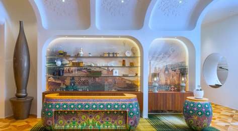 Kimpton bem budapest hotel reception with colourful check-in desk.