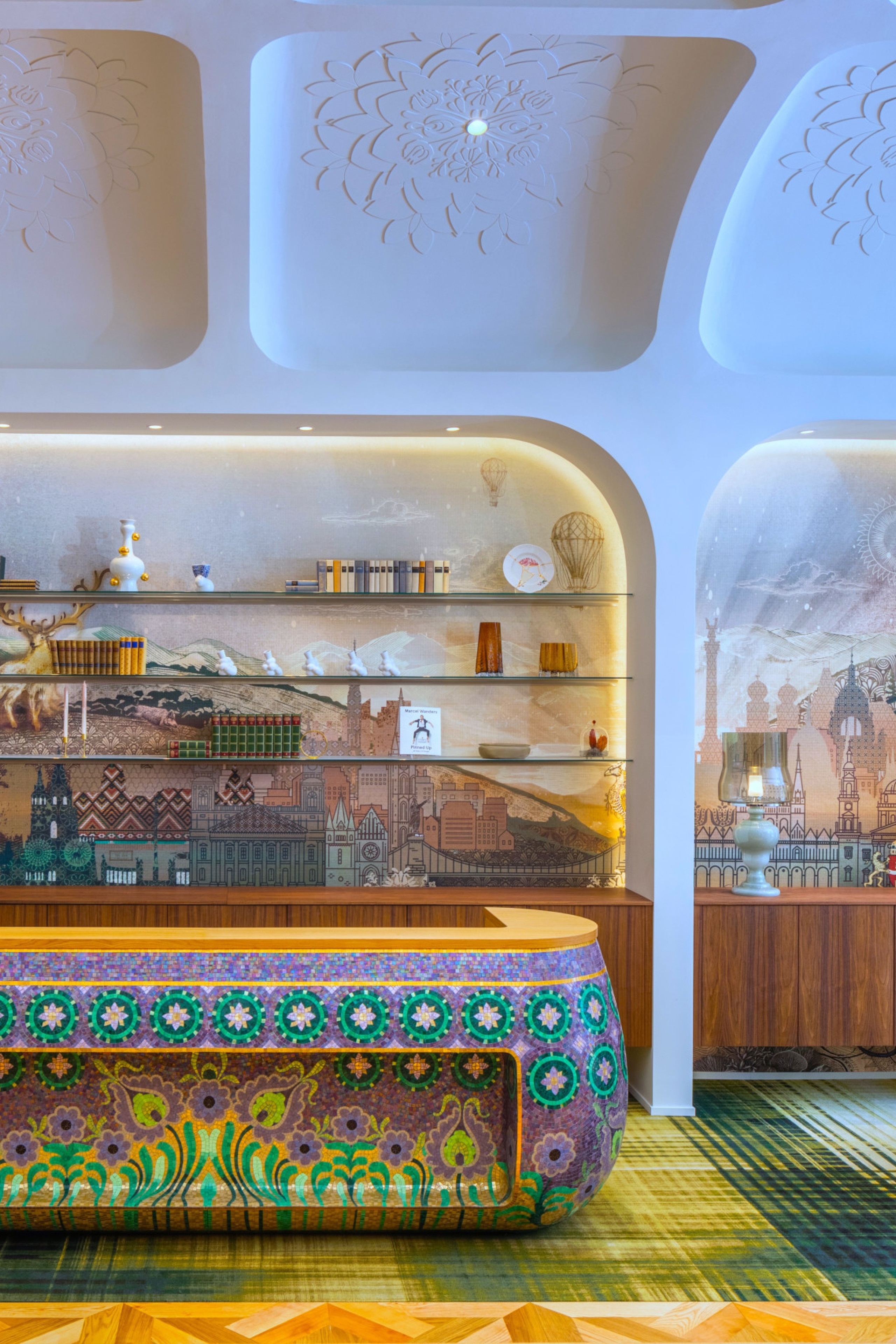 kimpton bem budapest hotel reception with colourful check-in desk