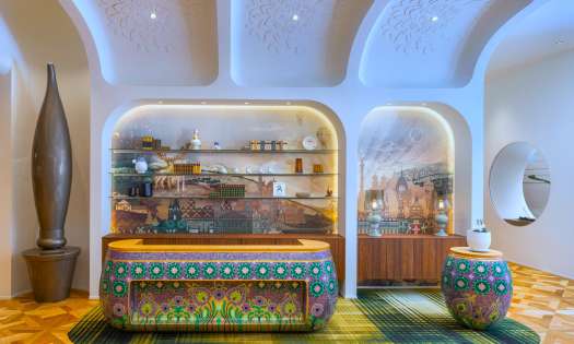 Kimpton bem budapest hotel reception with colourful check-in desk.