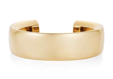 Curved gold bangle.