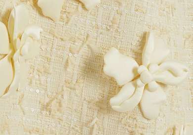 Yellow 3d flower details on dress.