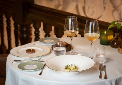 Table setting with two glasses of wine.
