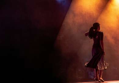 Actress on stage in theatre.