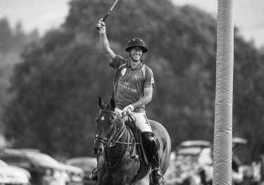 Polos prolific philanthropist nic roldan playing polo horse.