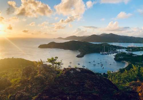 Sustainable sybarite announces luxury eco suites in Antigua beach view.