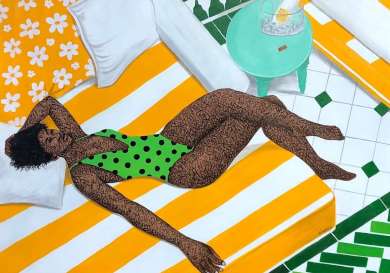 A person relaxes on a yellow-and-white striped chaise lounge in a green polka-dotted swimsuit.