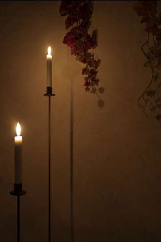 Two candles inside spa room.