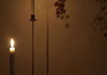 Two candles inside spa room.