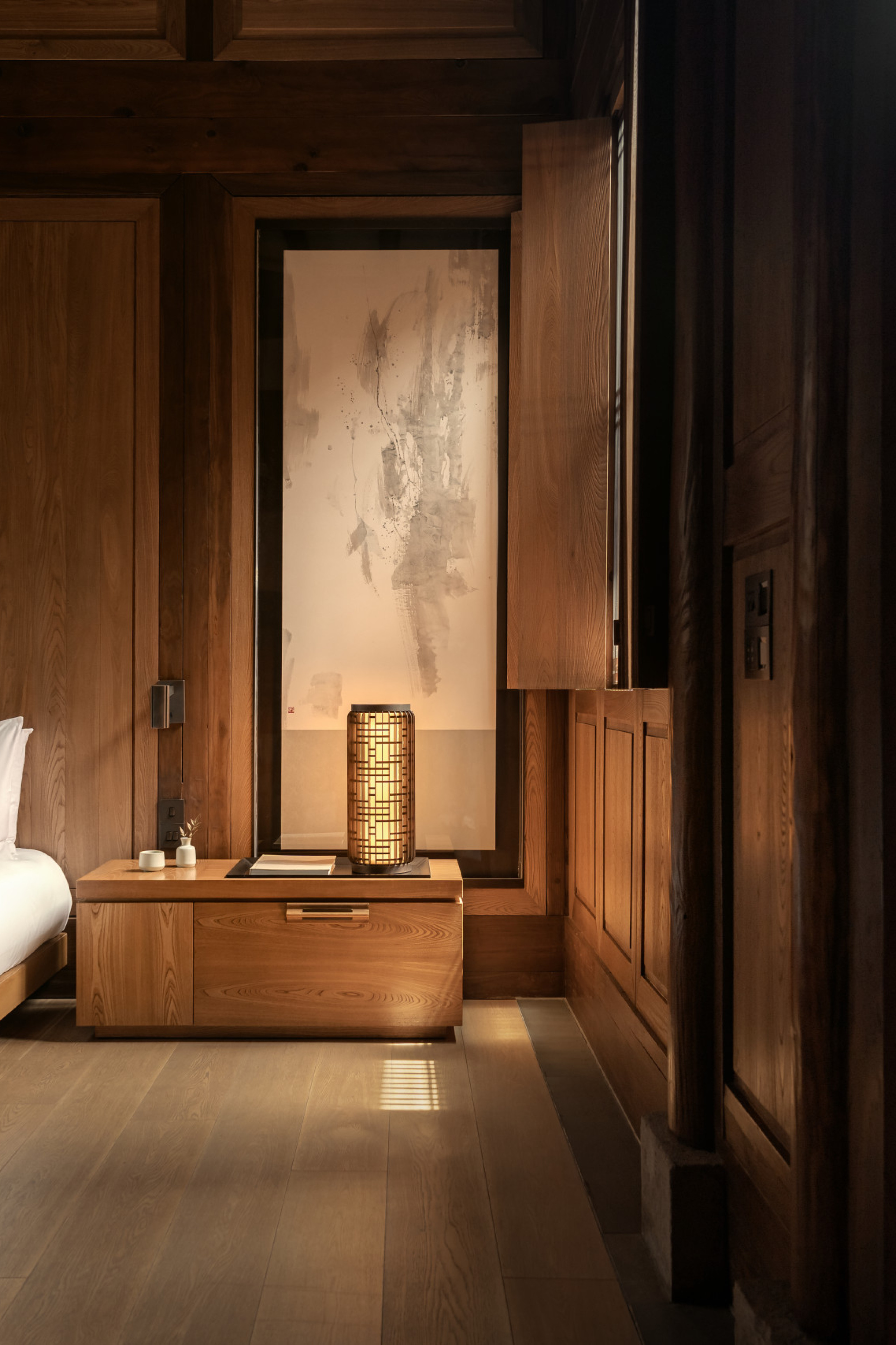 hotel bedroom interiors with warm wood and neutral colours