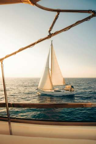Yacht with sails .