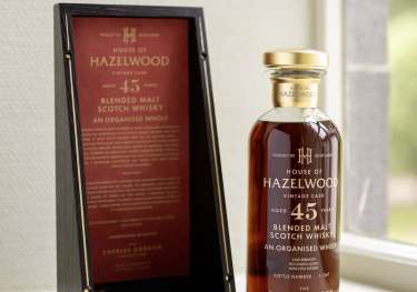 Bottle of whisky on windowsill .