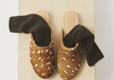 Pair of bambi slippers with socks .