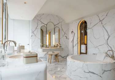 Marble hotel bathroom.