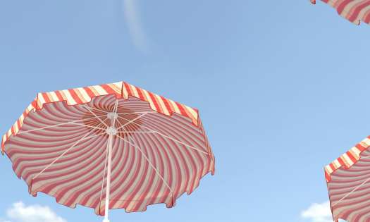 Red-and-white striped umbrellas jutting into blue sky.