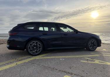 Side view of parked bmw 530e .