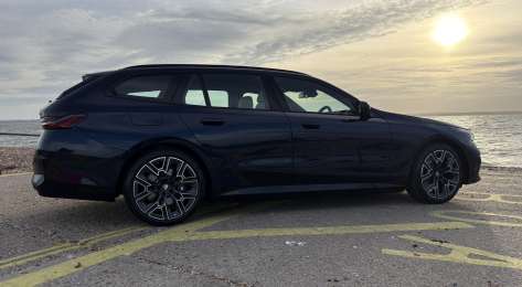 Side view of parked bmw 530e .
