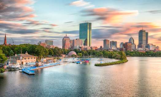Skyline view of boston over the water.