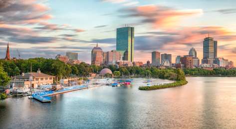 Skyline view of boston over the water.