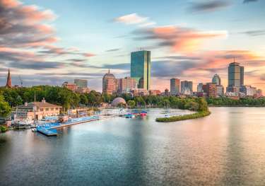 Skyline view of boston over the water.