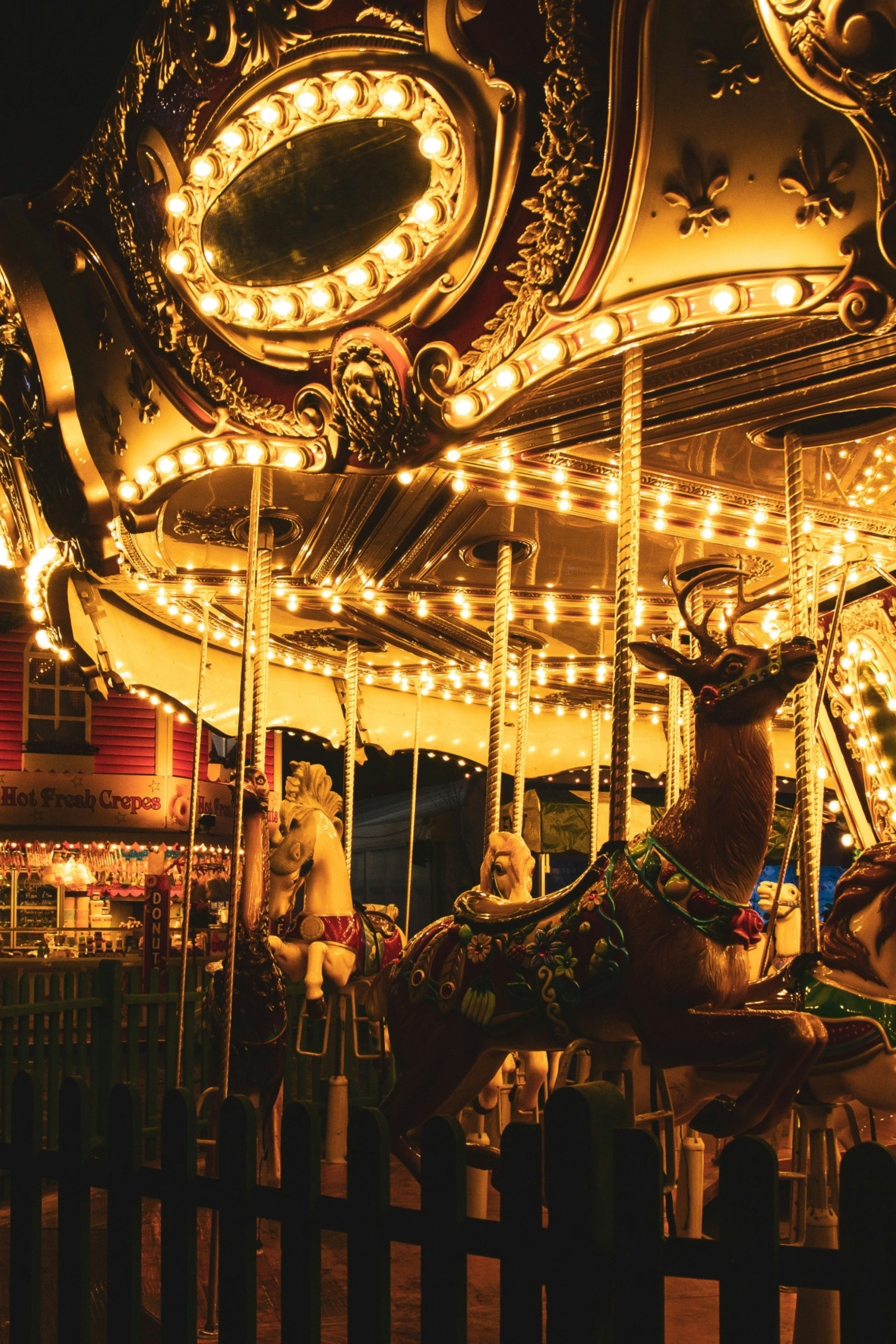 illuminated carousel at christmas market 