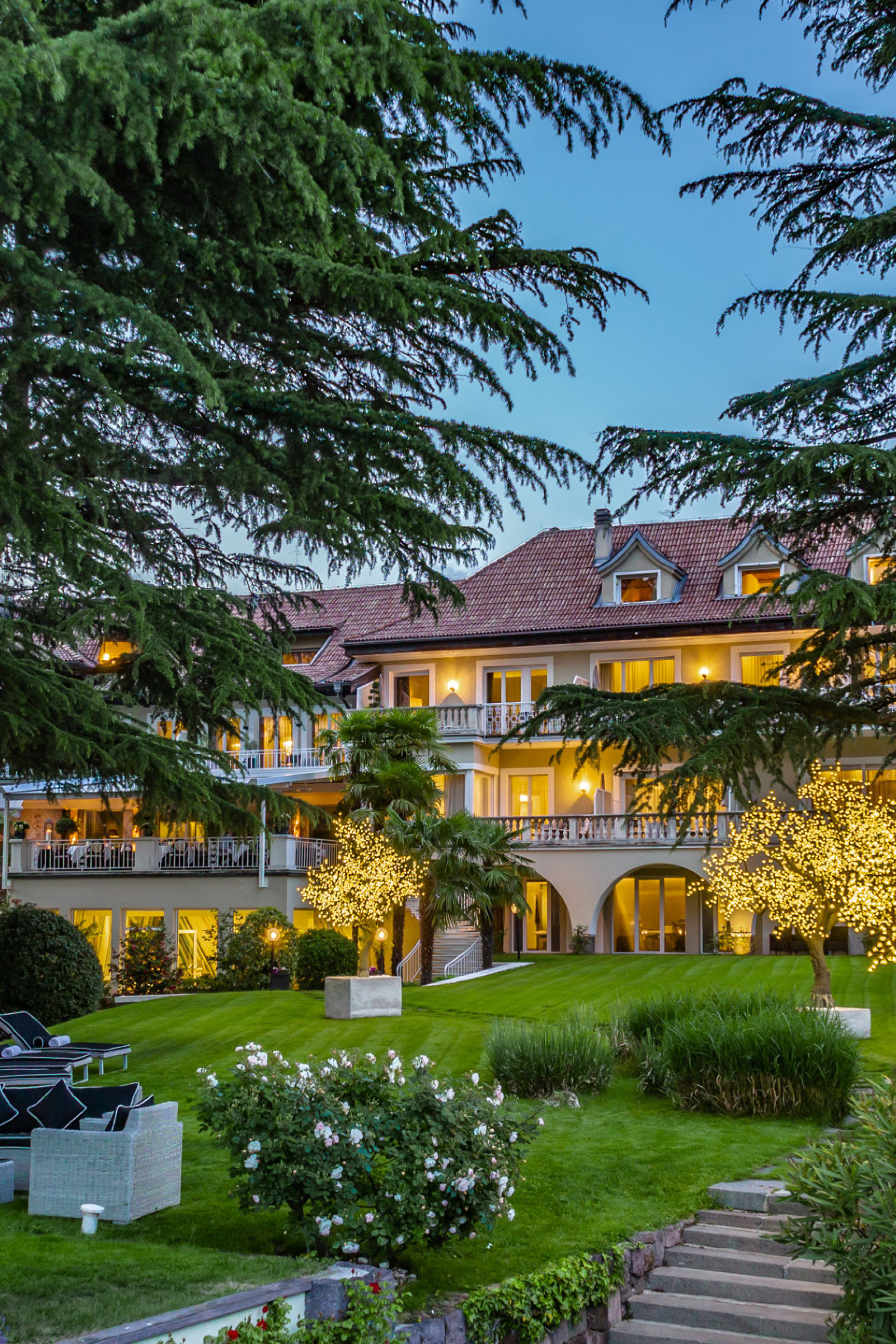 exterior view of villa eden with trees framing the retreat 