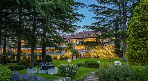 Exterior view of villa eden with trees framing the retreat .