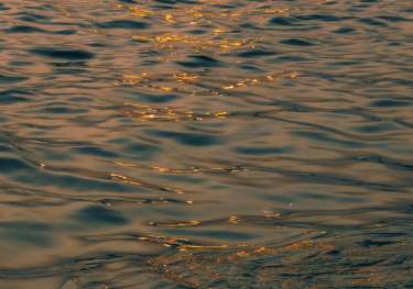 Sea at sunset .