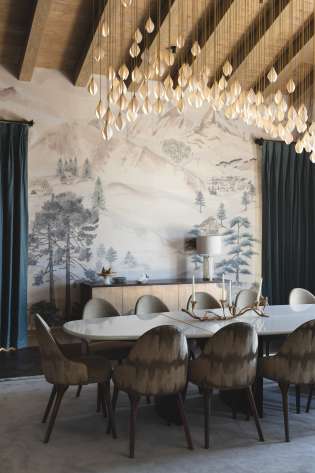 Chalet dining room with hanging lights.