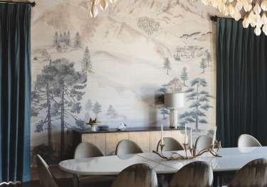 Chalet dining room with hanging lights.