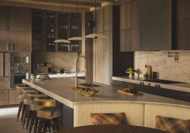 Family kitchen with bar stools .