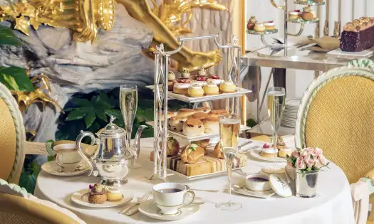 Champagne afternoon tea table set up.