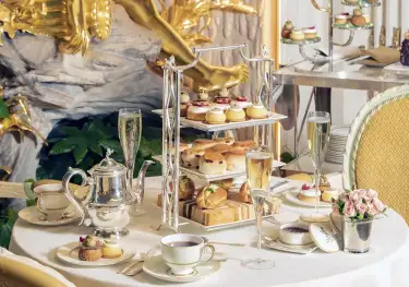 Champagne afternoon tea table set up.