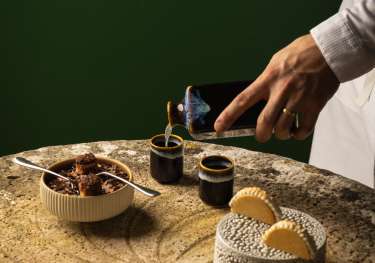 Chef preparing dessert inside hotel .