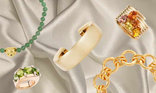 Chunky jewellery pieces on cream silk fabric.