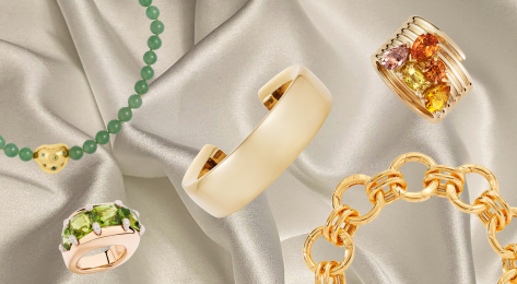 Chunky jewellery pieces on cream silk fabric.