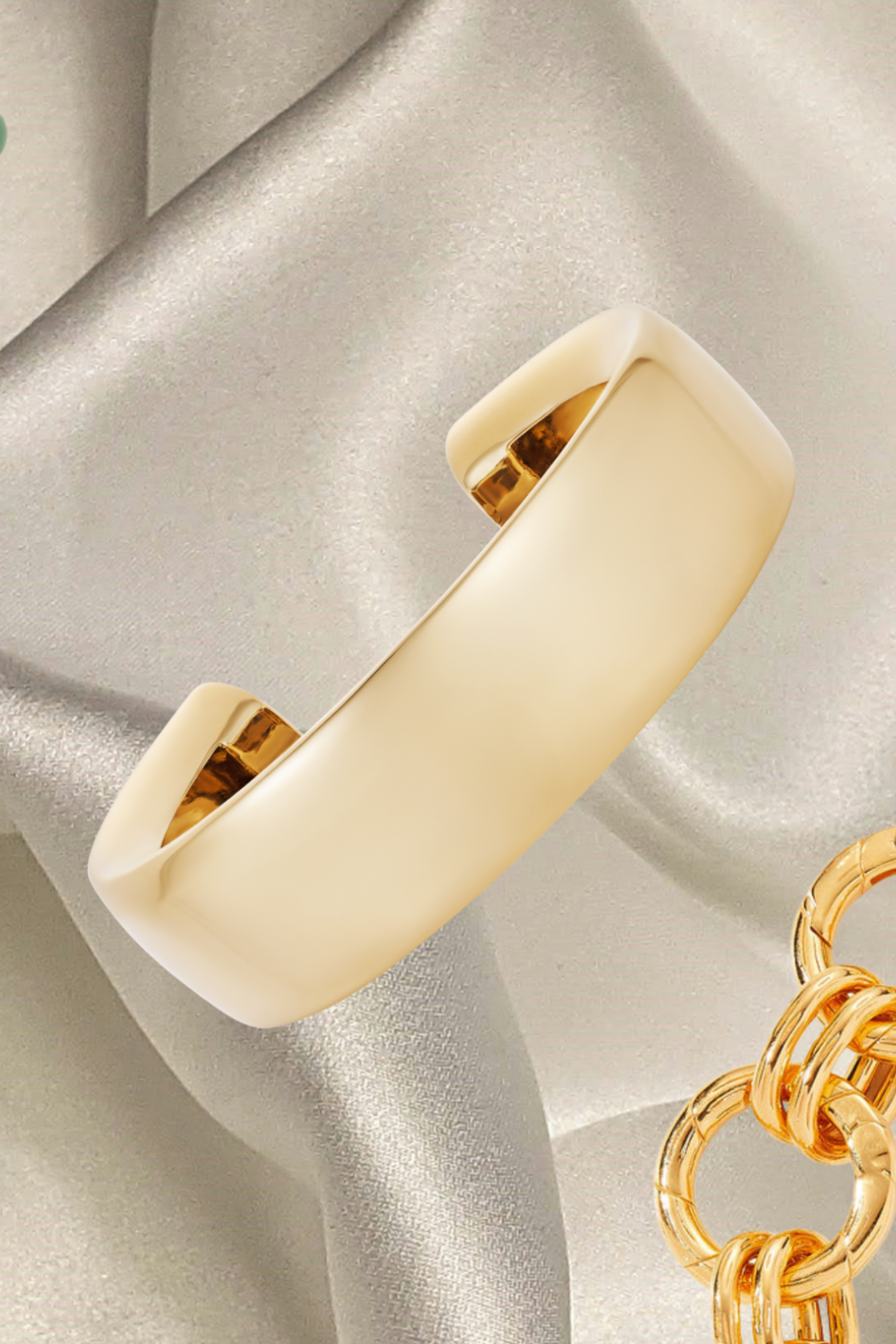 chunky jewellery pieces on cream silk fabric