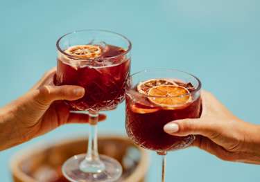 Two glasses of citrus red wine sangria.
